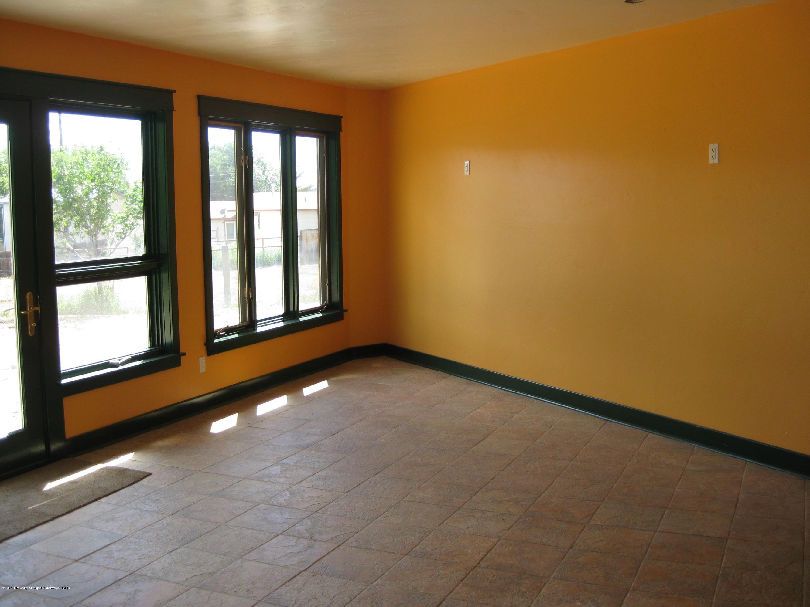 653 East 7th Street Rifle, CO 81650 - Photo 11 of 16 an empty room with windows