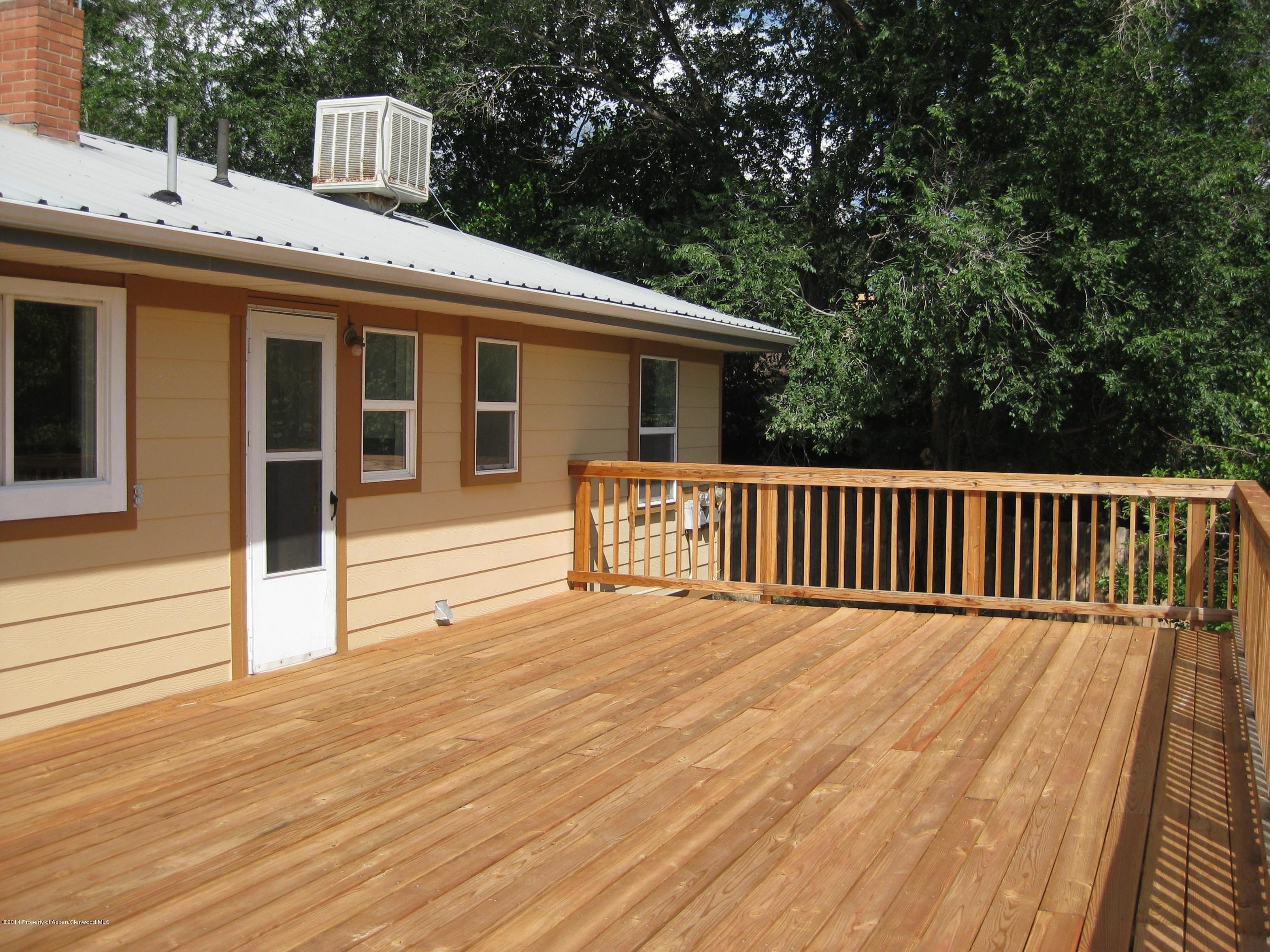 653 East 7th Street Rifle, CO 81650 - Photo 13 of 16 a view of a house with a deck