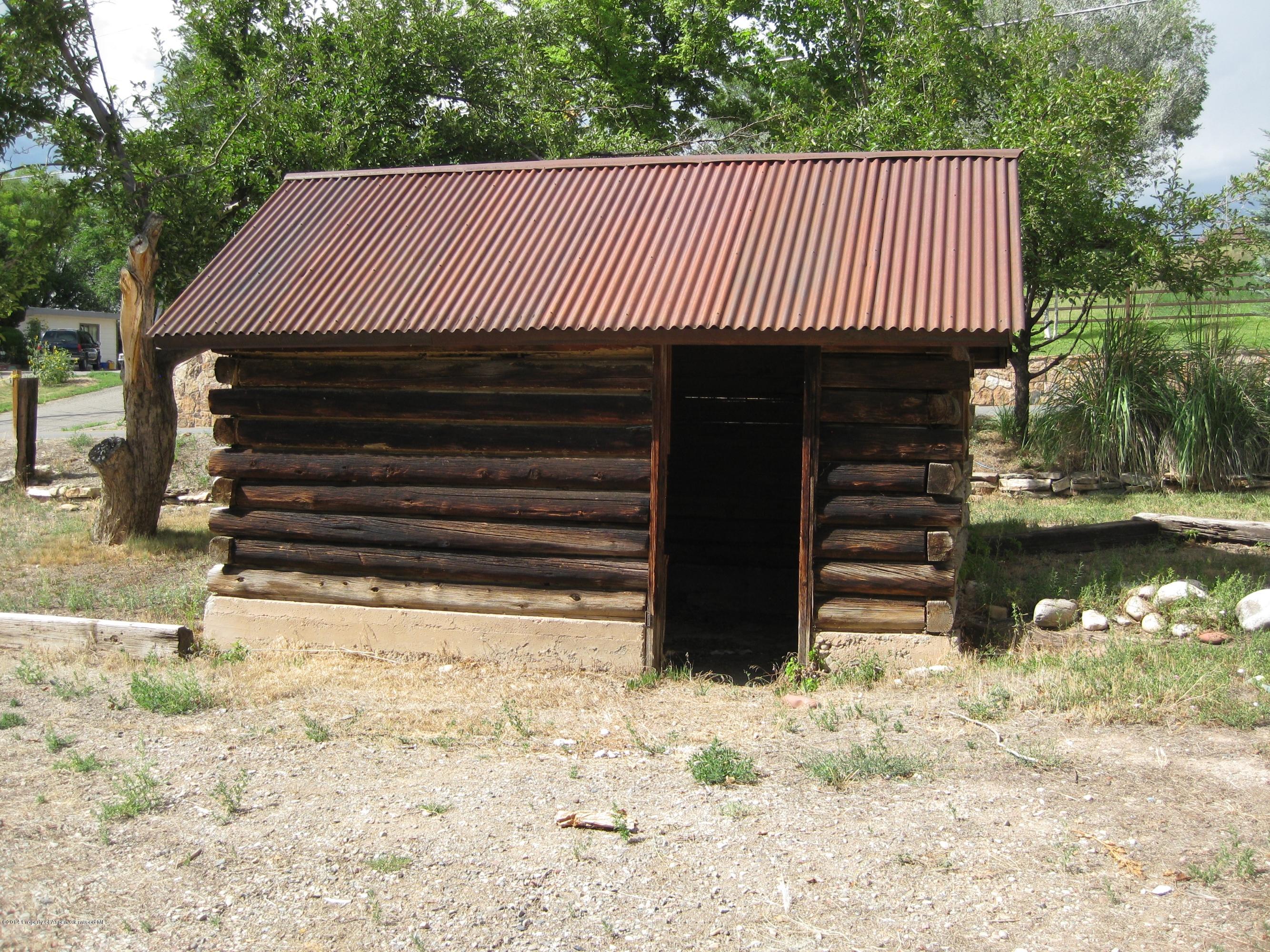 653 East 7th Street Rifle, CO 81650 - Photo 16 of 16 a front view of a house with a yard