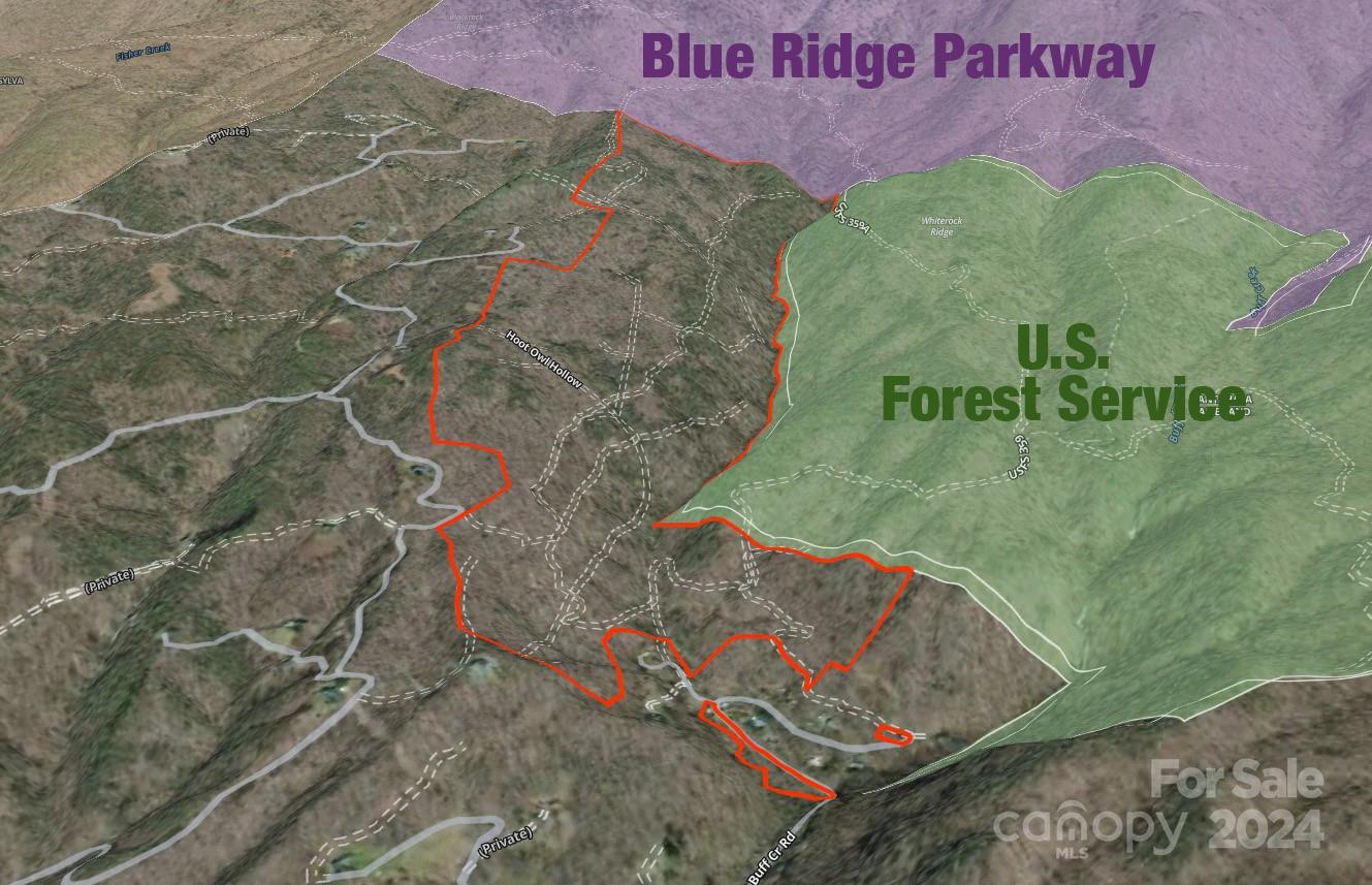 0 Buff Creek Road Sylva, NC 28779 - Photo 2 of 21 a sign that is sitting on a bed