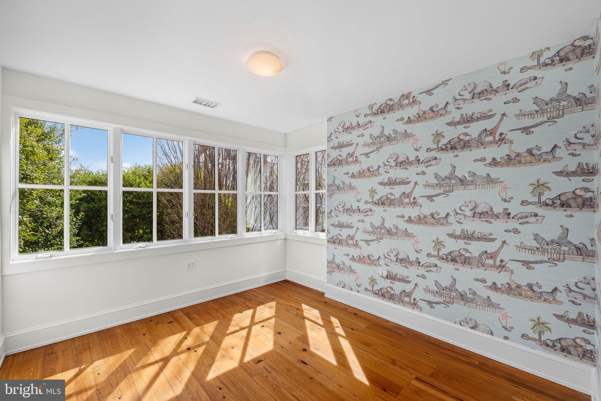 2912 Dumbarton Street Northwest Washington, DC 20007 - Photo 13 of 22 a view of a big room with wooden floor and windows