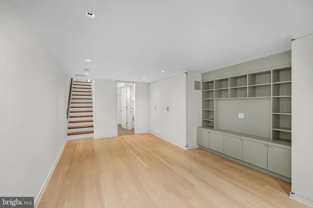 a view of bathroom with washing machine and a sink