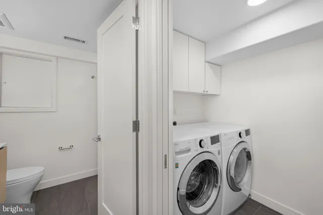a bathroom with a sink toilet and vanity