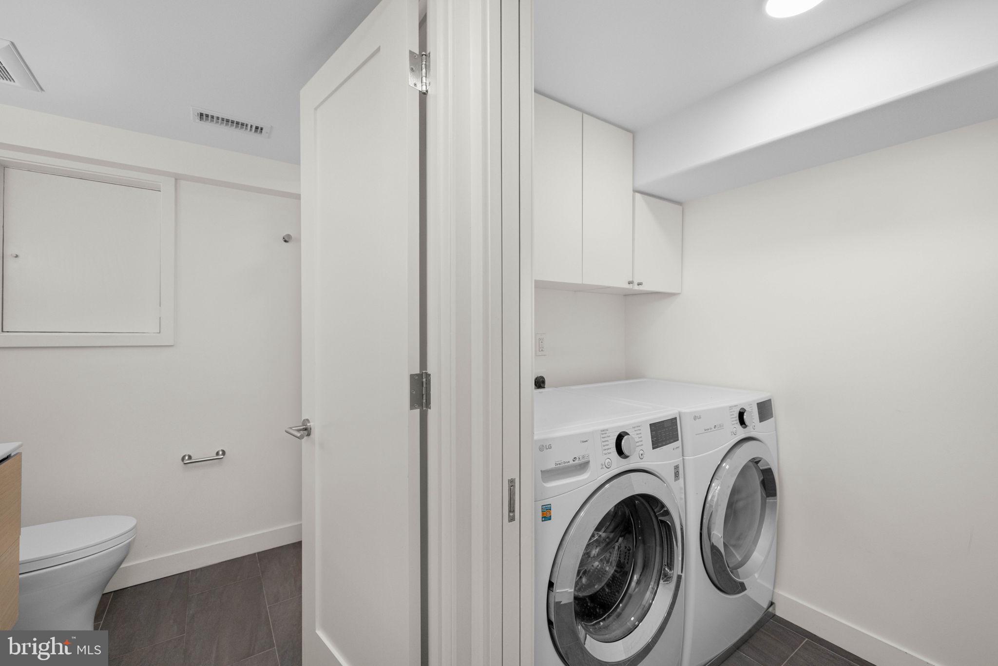2912 Dumbarton Street Northwest Washington, DC 20007 - Photo 16 of 22 a view of bathroom with washing machine and a sink