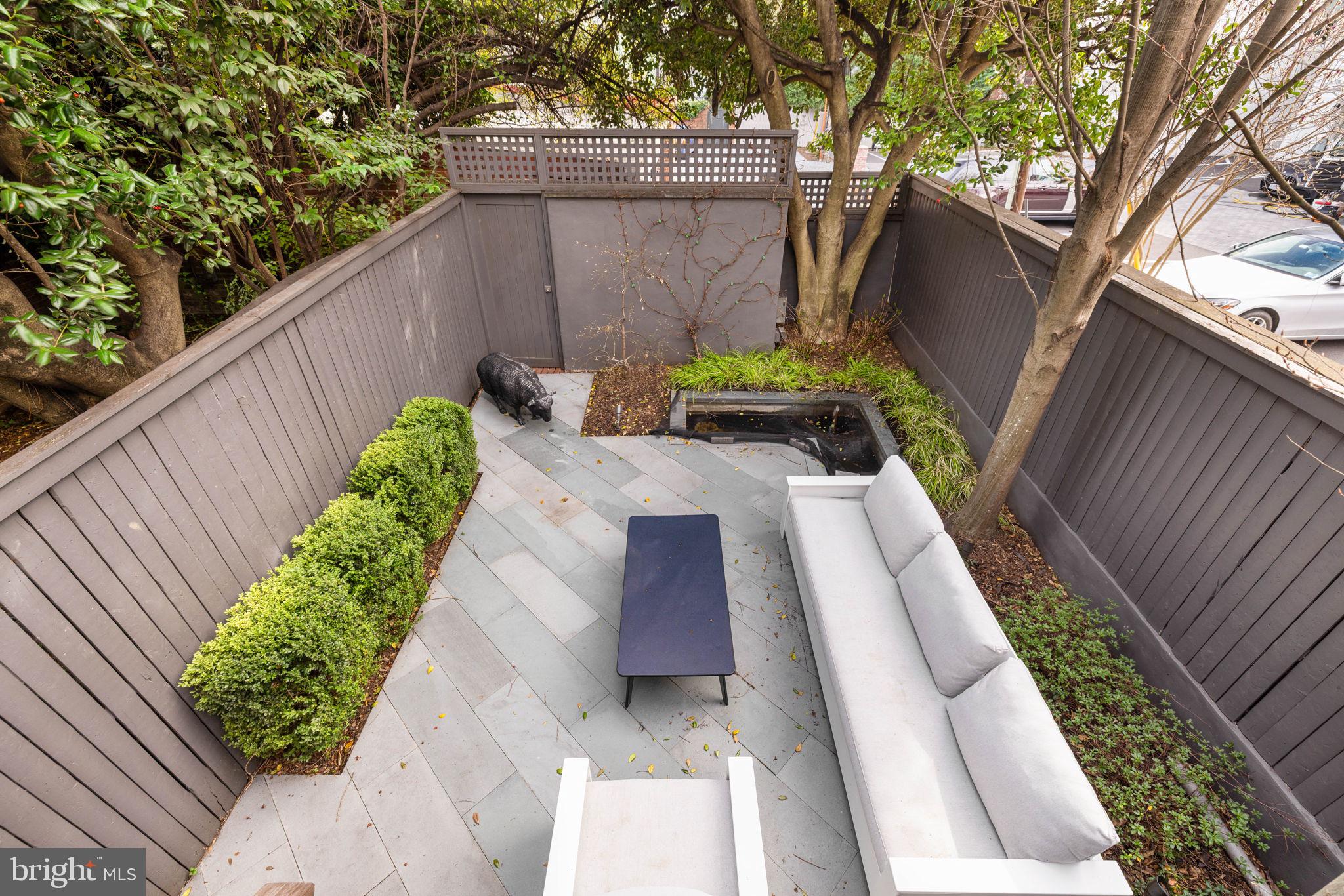 2912 Dumbarton Street Northwest Washington, DC 20007 - Photo 19 of 22 a view of a yard with chairs