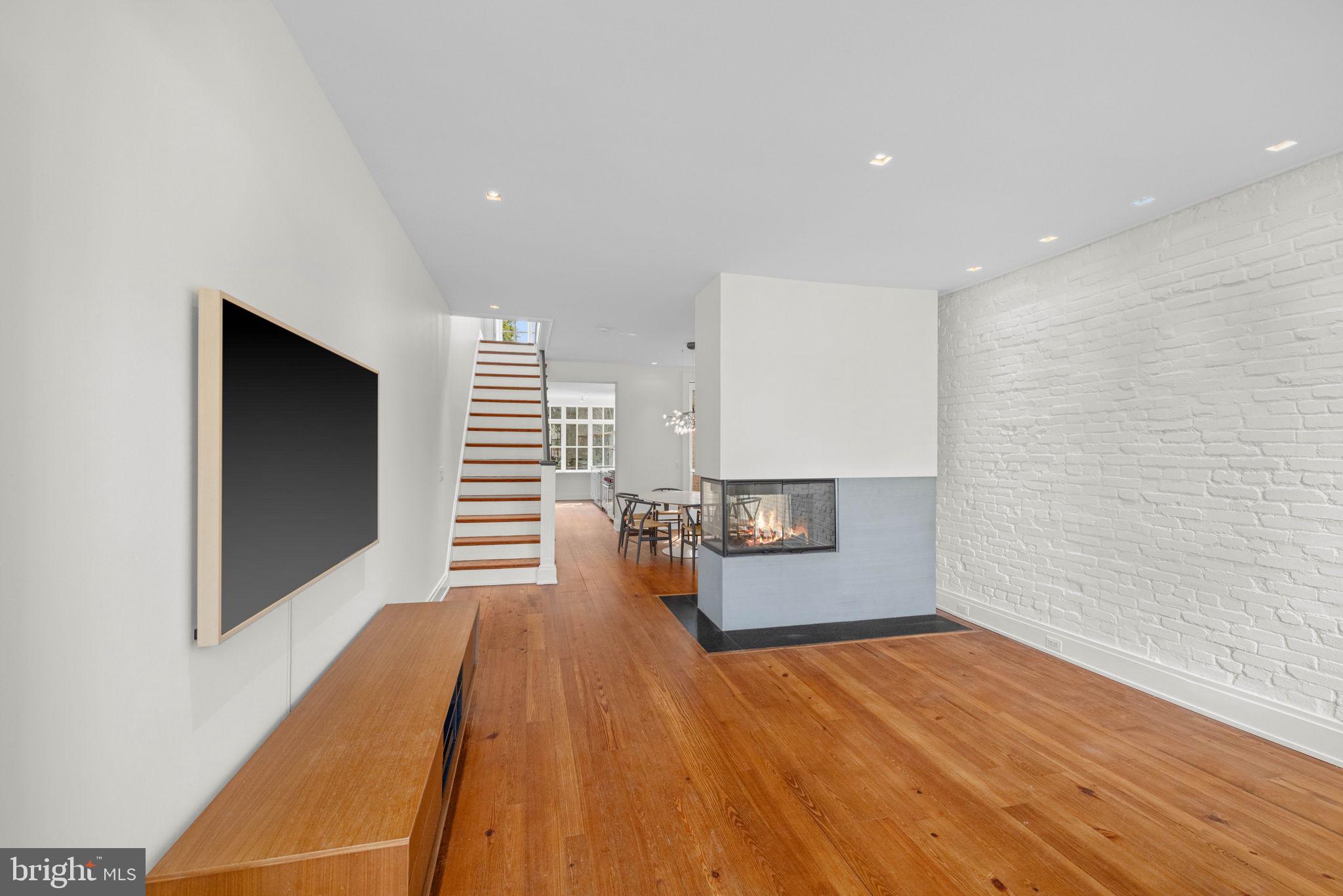 2912 Dumbarton Street Northwest Washington, DC 20007 - Photo 2 of 22 a view of a living room with wooden floor