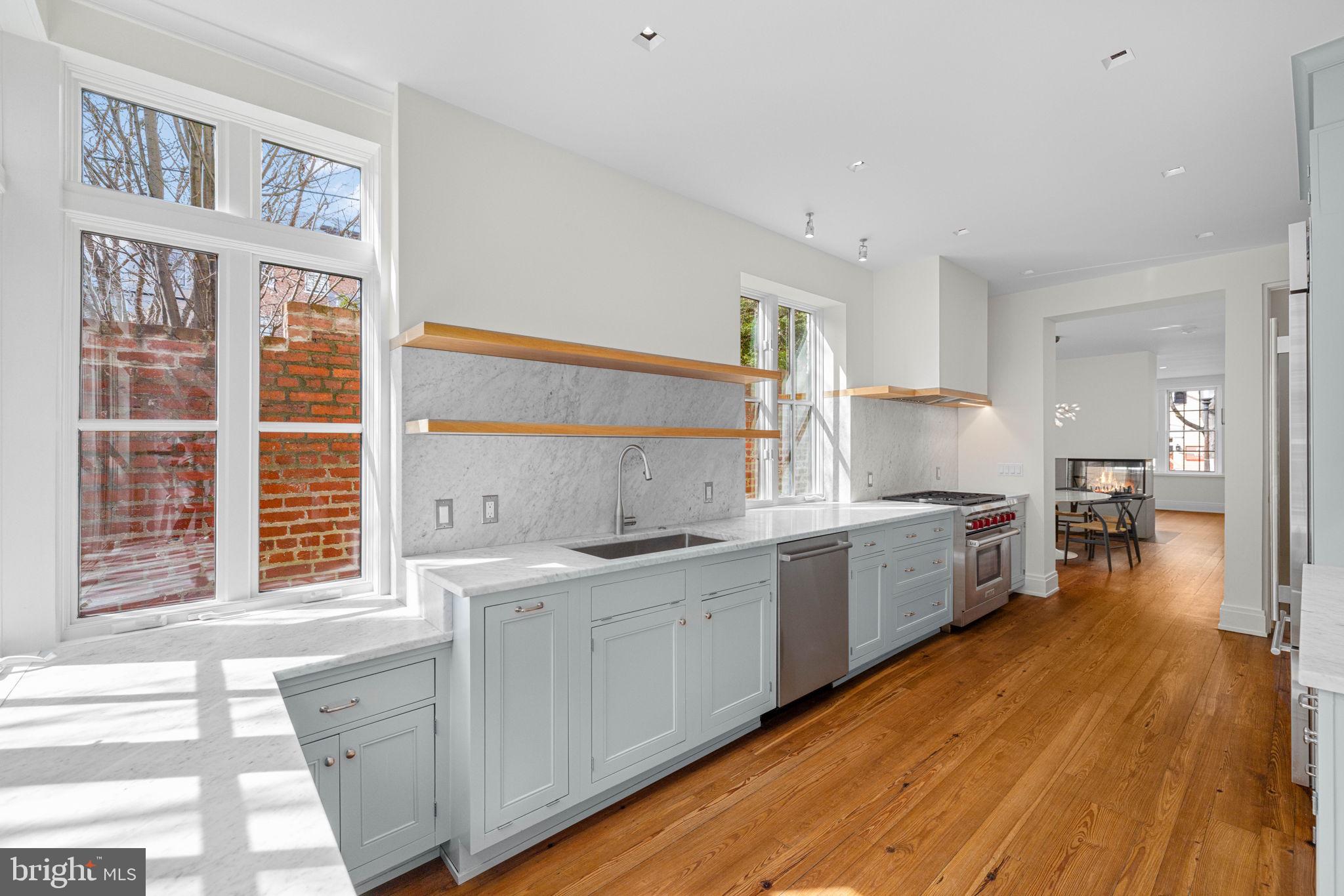 2912 Dumbarton Street Northwest Washington, DC 20007 - Photo 5 of 22 a large kitchen with a lot of counter space and wooden floor