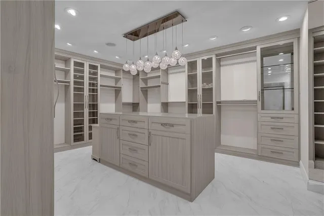 a bathroom with a double vanity sink a toilet a shower and a mirror