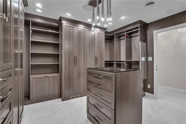a bathroom with a shower and a sink
