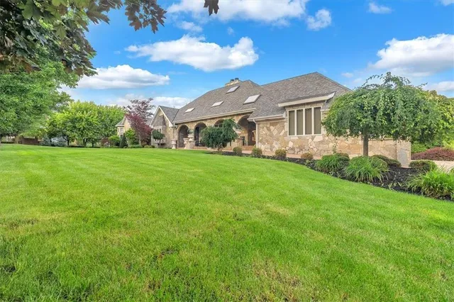a view of a house with a big yard
