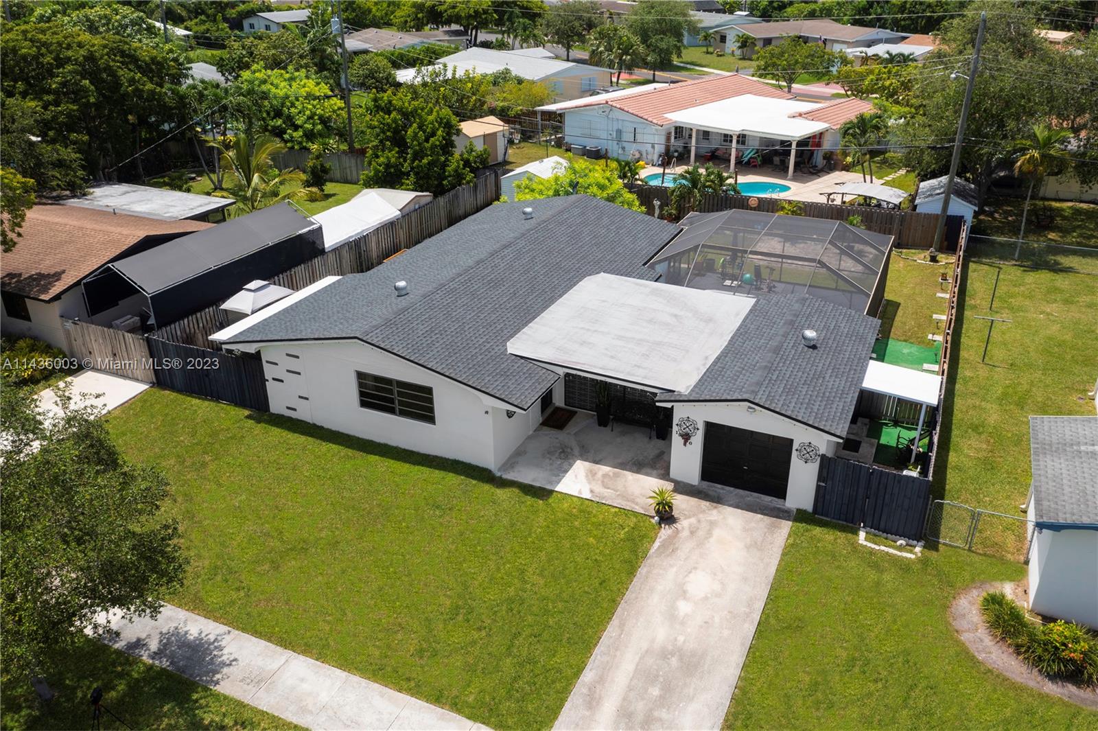 19260 Southwest 93rd Road Cutler Bay, FL 33157 - Photo 14 of 19 aerial view of a house with swimming pool yard and outdoor seating