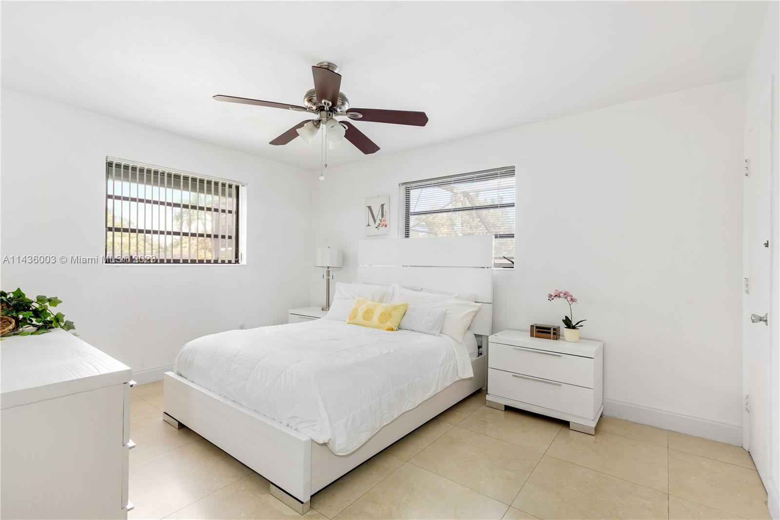 19260 Southwest 93rd Road Cutler Bay, FL 33157 - Photo 6 of 19 a bedroom with a bed and a window