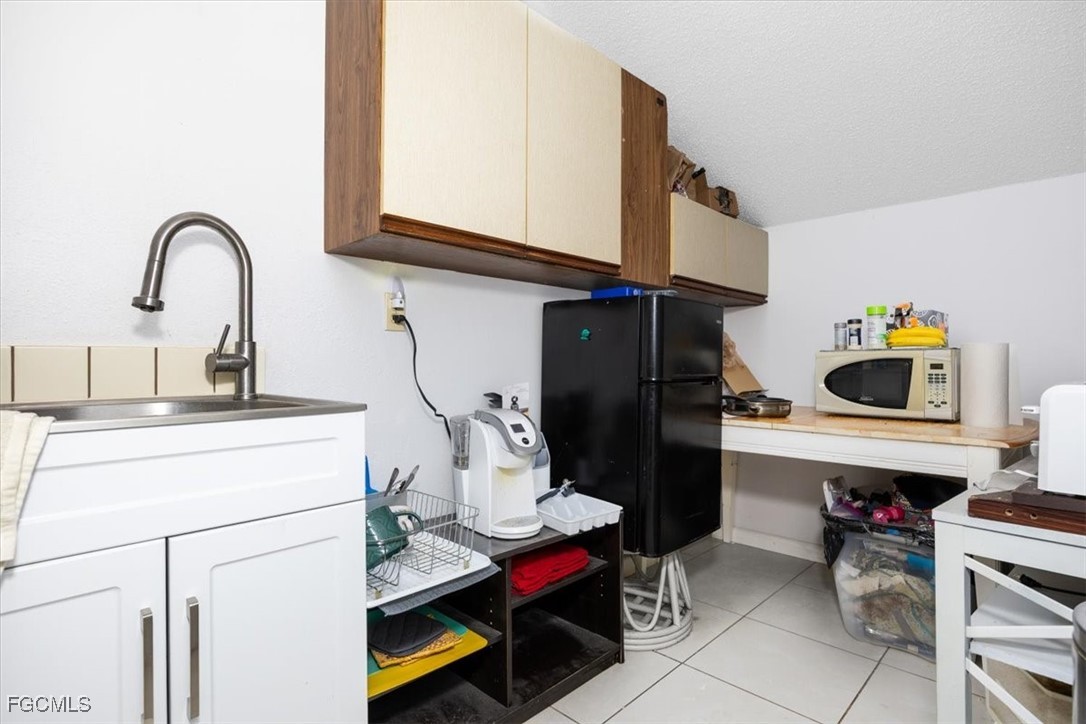 7261 Albany Road Fort Myers, FL 33967 - Photo 13 of 27 a room with storage and utility