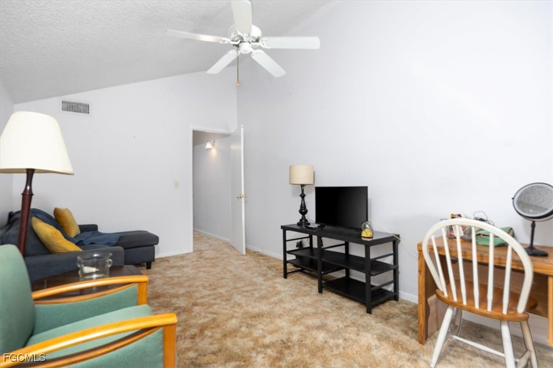 7261 Albany Road Fort Myers, FL 33967 - Photo 14 of 27 a living room with furniture and a flat screen tv