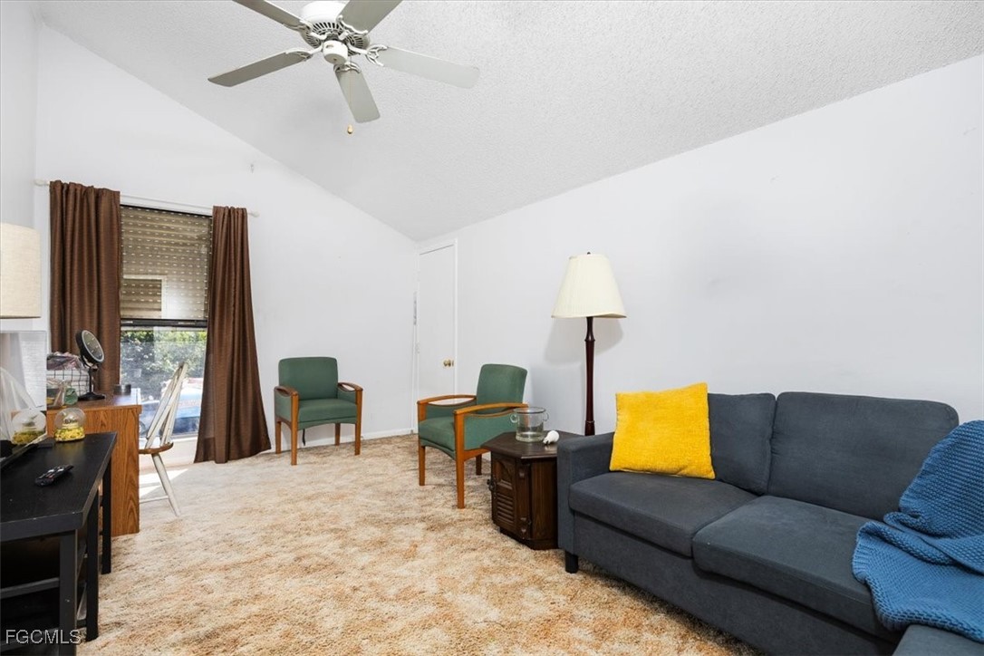 7261 Albany Road Fort Myers, FL 33967 - Photo 16 of 27 a living room with furniture and a lamp