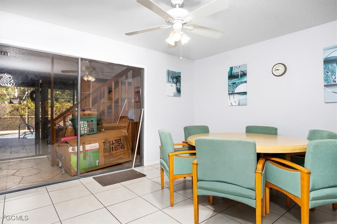 7261 Albany Road Fort Myers, FL 33967 - Photo 20 of 27 a living room with furniture and a chandelier