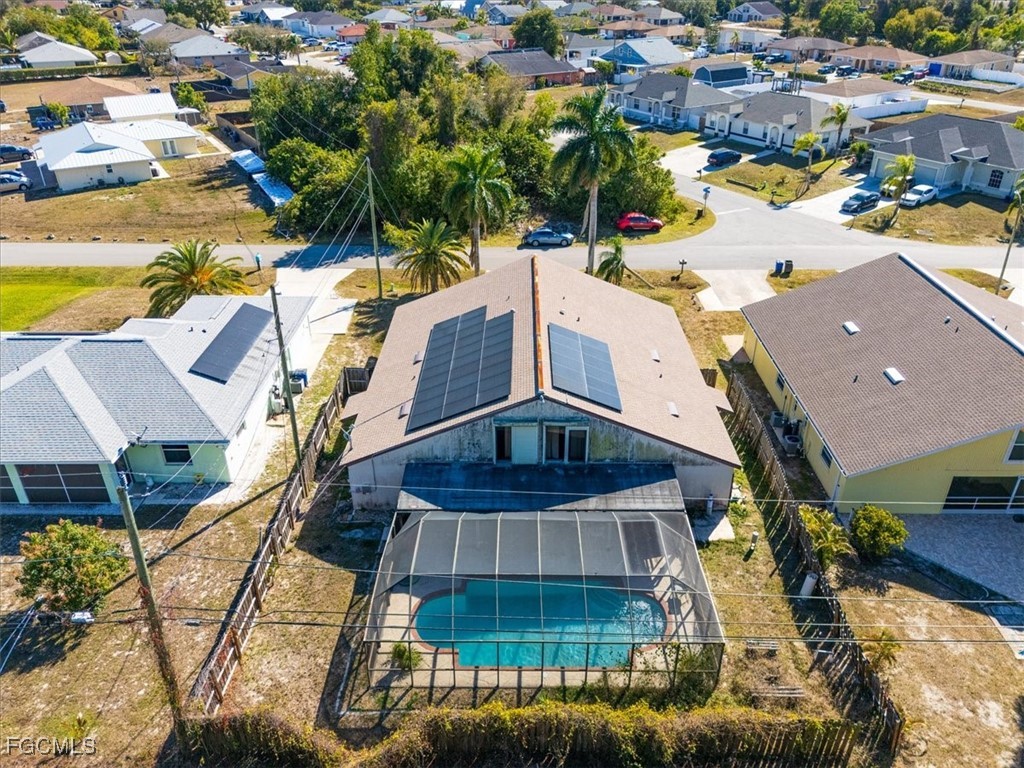 7261 Albany Road Fort Myers, FL 33967 - Photo 2 of 27 a view of a swimming pool with a patio and a yard