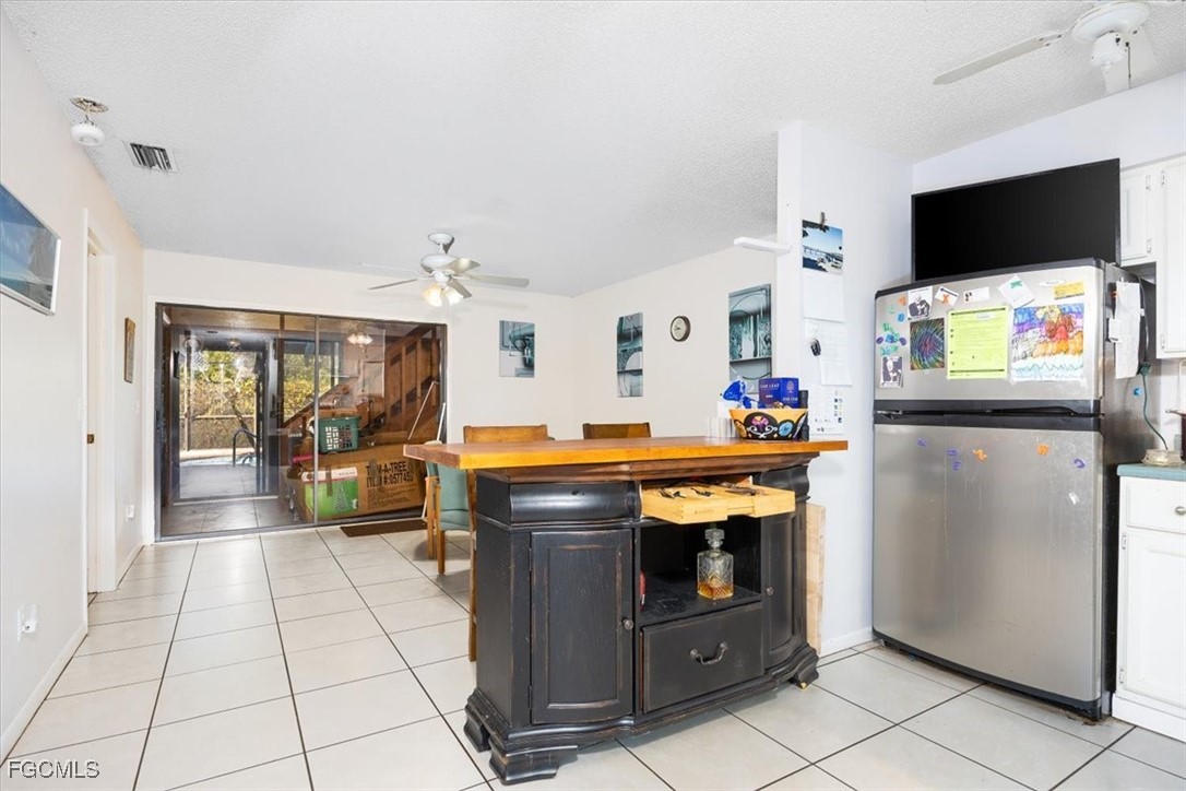 7261 Albany Road Fort Myers, FL 33967 - Photo 24 of 27 a room with furniture a flat screen tv and a view of living room