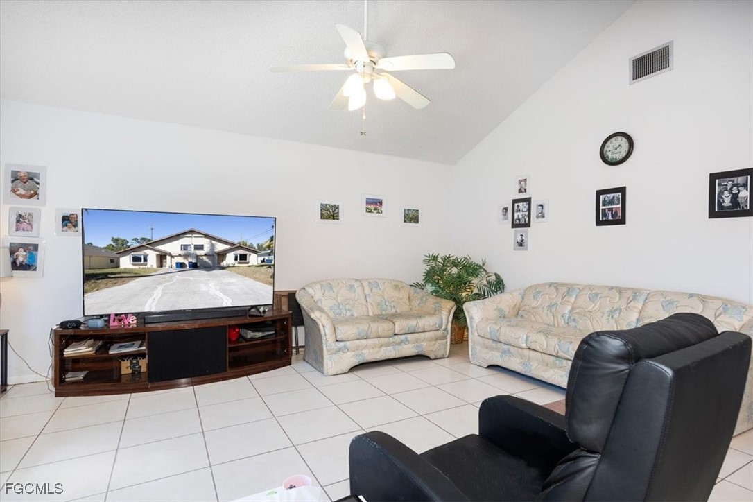 7261 Albany Road Fort Myers, FL 33967 - Photo 25 of 27 a living room with furniture and a chandelier