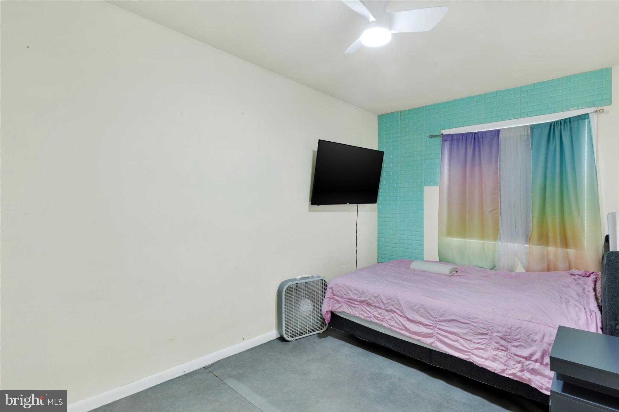 1211 Wabank Street Lancaster, PA 17603 - Photo 15 of 26 a bedroom with a bed and a flat screen tv