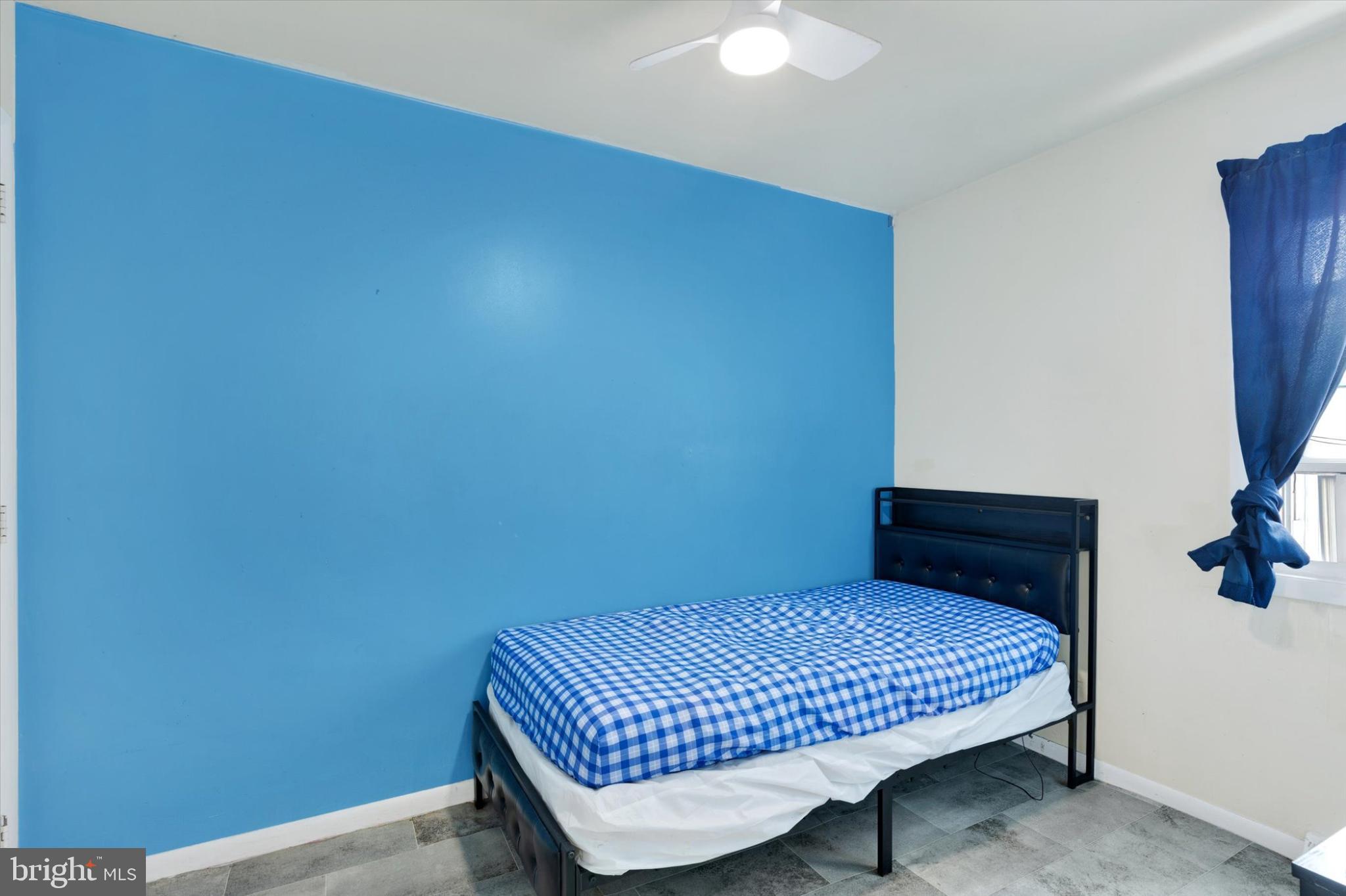 1211 Wabank Street Lancaster, PA 17603 - Photo 17 of 26 a bedroom with a bed and wooden floor