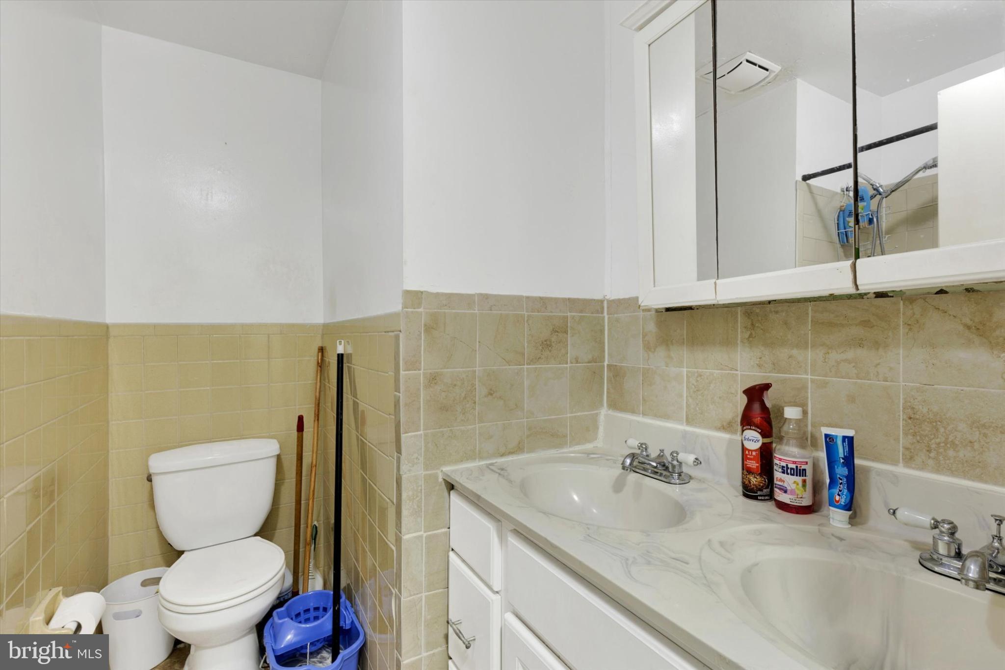 1211 Wabank Street Lancaster, PA 17603 - Photo 20 of 26 a bathroom with a sink a toilet and shower