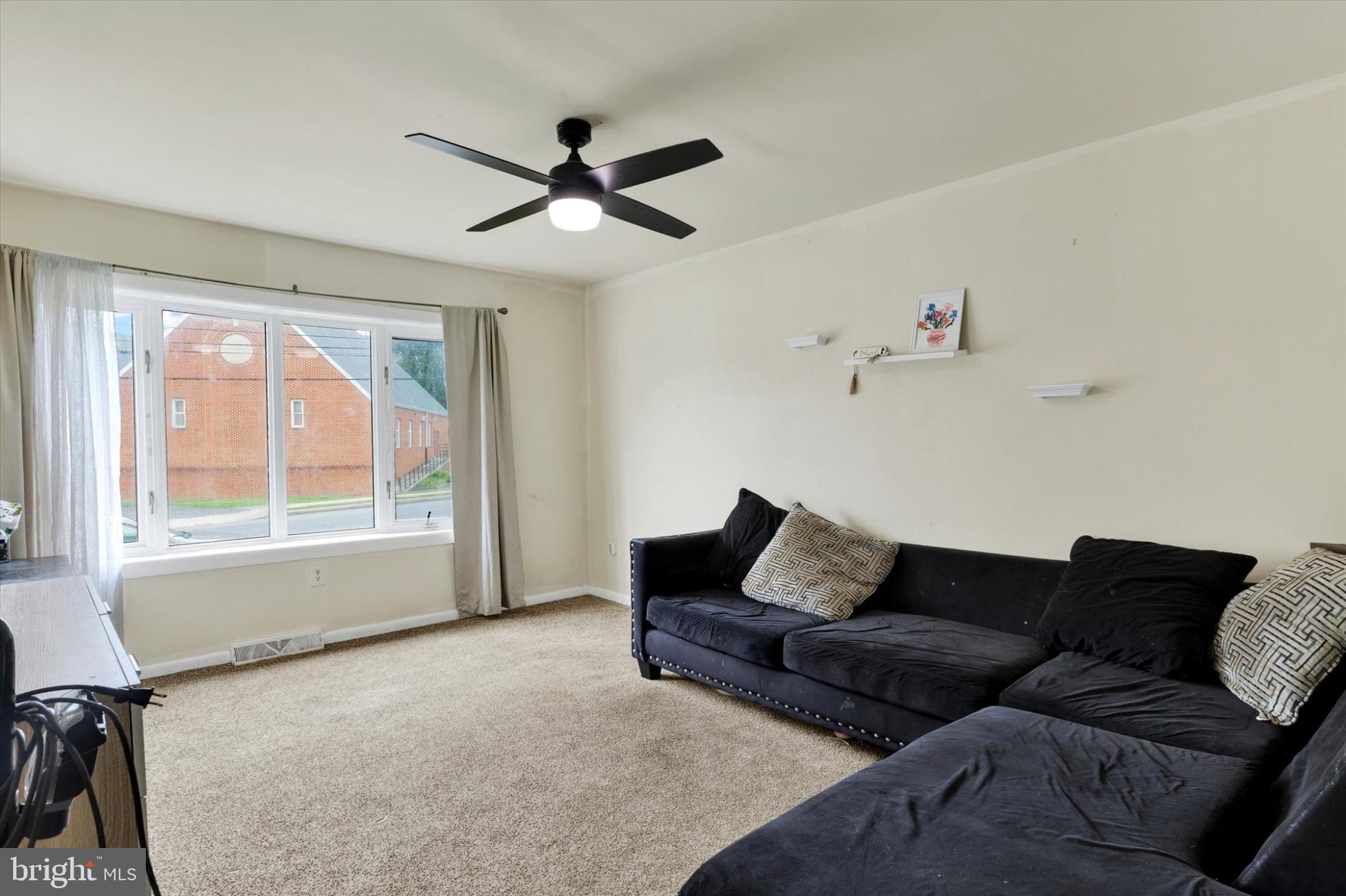 1211 Wabank Street Lancaster, PA 17603 - Photo 8 of 26 a living room with furniture and a window