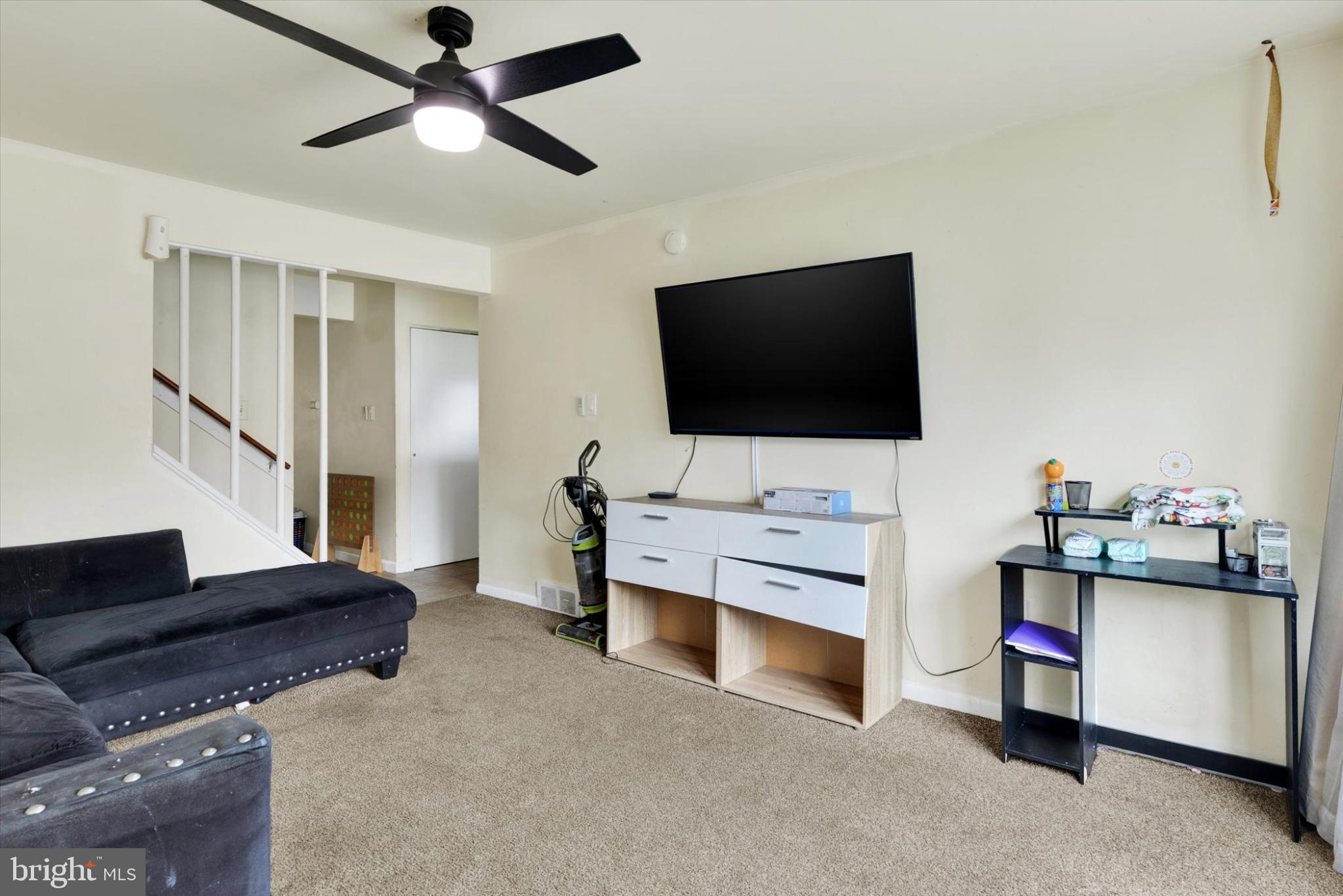 1211 Wabank Street Lancaster, PA 17603 - Photo 9 of 26 a living room with furniture and a flat screen tv