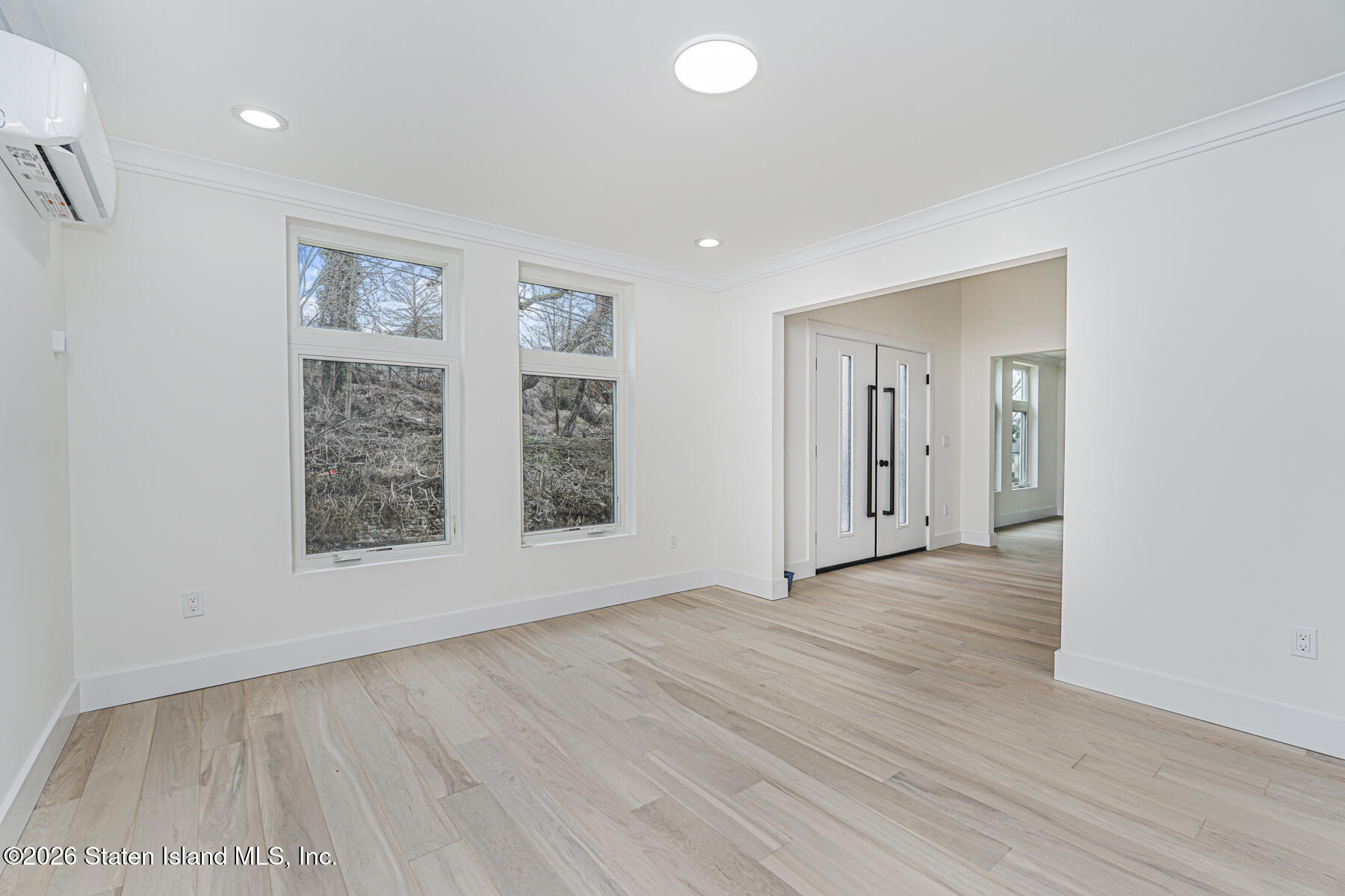 54 Cedarcliff Road Staten Island, NY 10301 - Photo 18 of 49 an empty room with wooden floor and windows