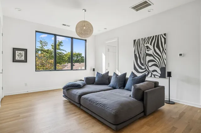 a bedroom with a bed and a chair