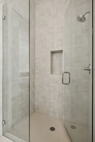 a bedroom with a bed dresser and a window