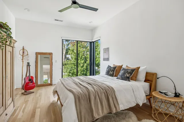 a bedroom with a bed and a window