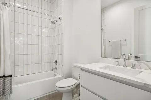 a utility room with sink dryer and washer