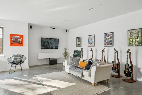 a workspace with furniture window and wooden floor