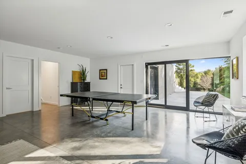 a view of a livingroom with furniture and a window