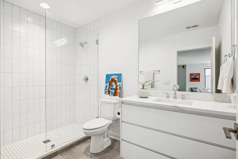 a view of an outdoor dining space with a table and chairs