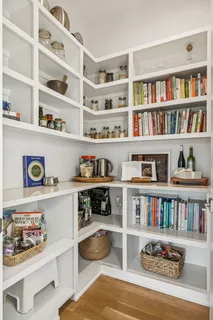a cabinet with a book shelf and a book shelf