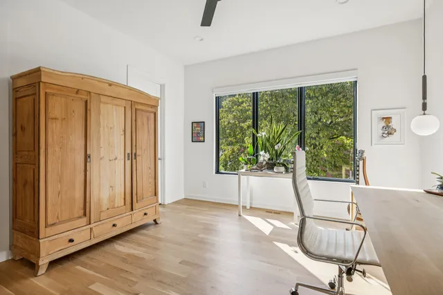a view of a livingroom with furniture and a window