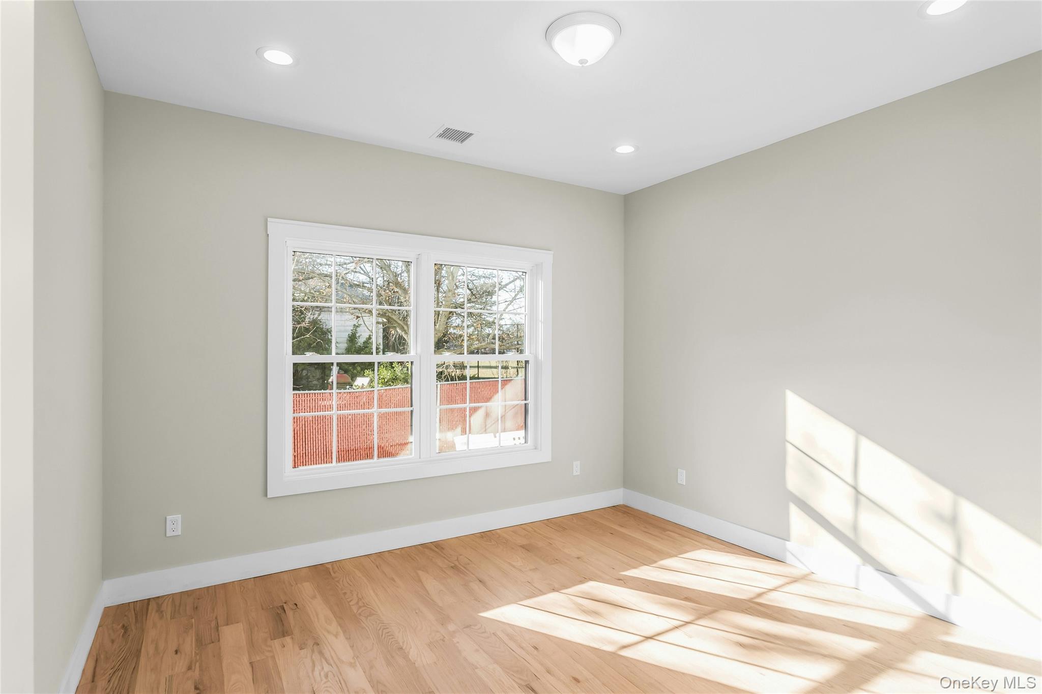47 Shelter Hill Road Plainview, NY 11803 - Photo 13 of 22 a view of an empty room and window