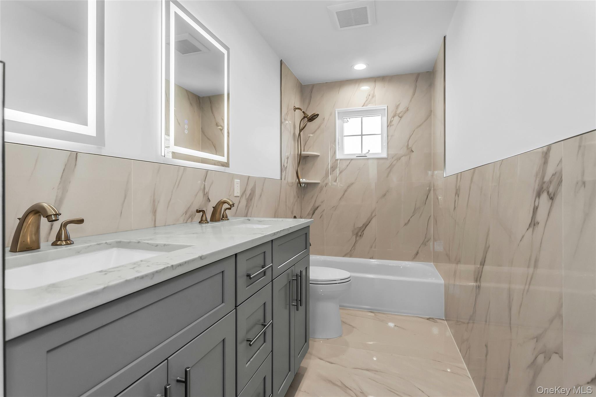 47 Shelter Hill Road Plainview, NY 11803 - Photo 20 of 22 a bathroom with a granite countertop sink toilet and shower