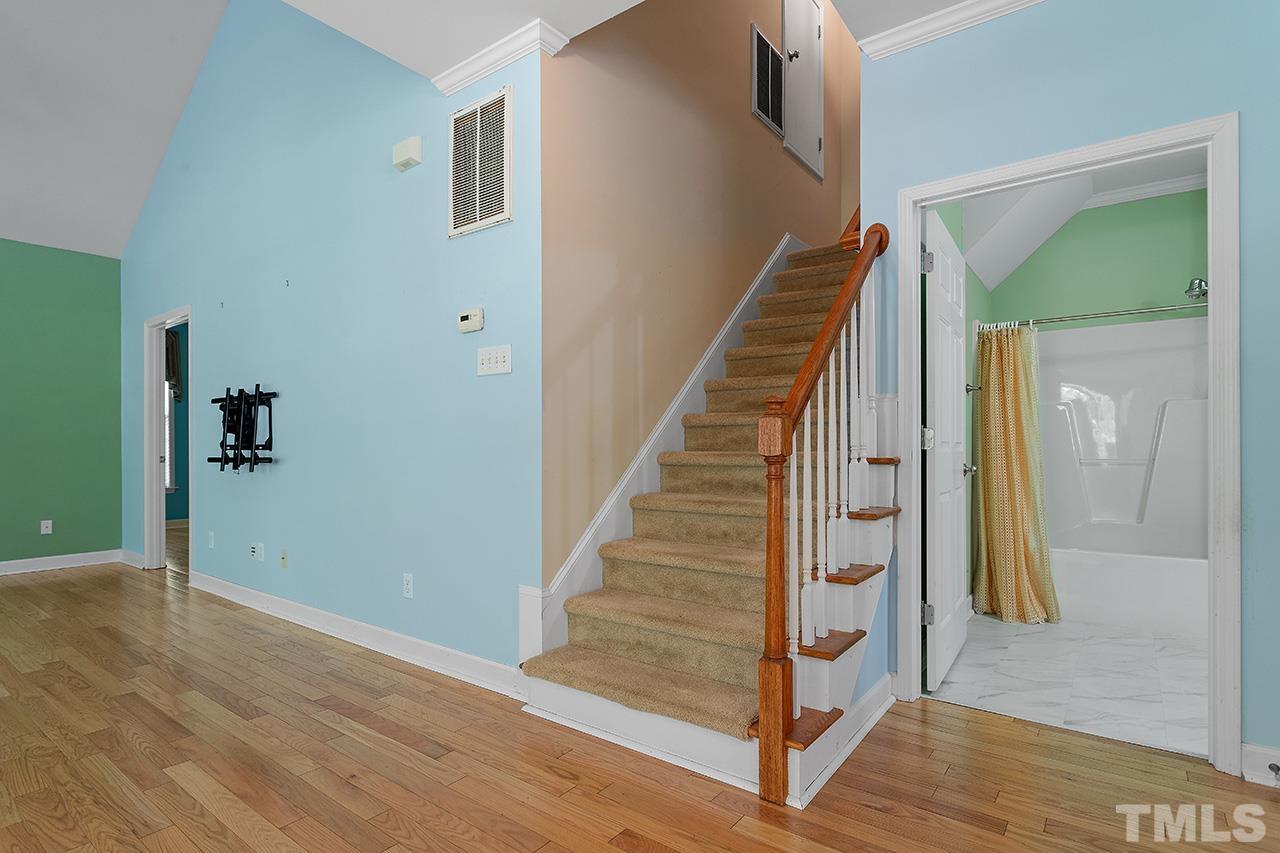 844 Horton Road, Unit 64 Durham, NC 27704 - Photo 19 of 25 a view of a hallway with wooden floor and entryway