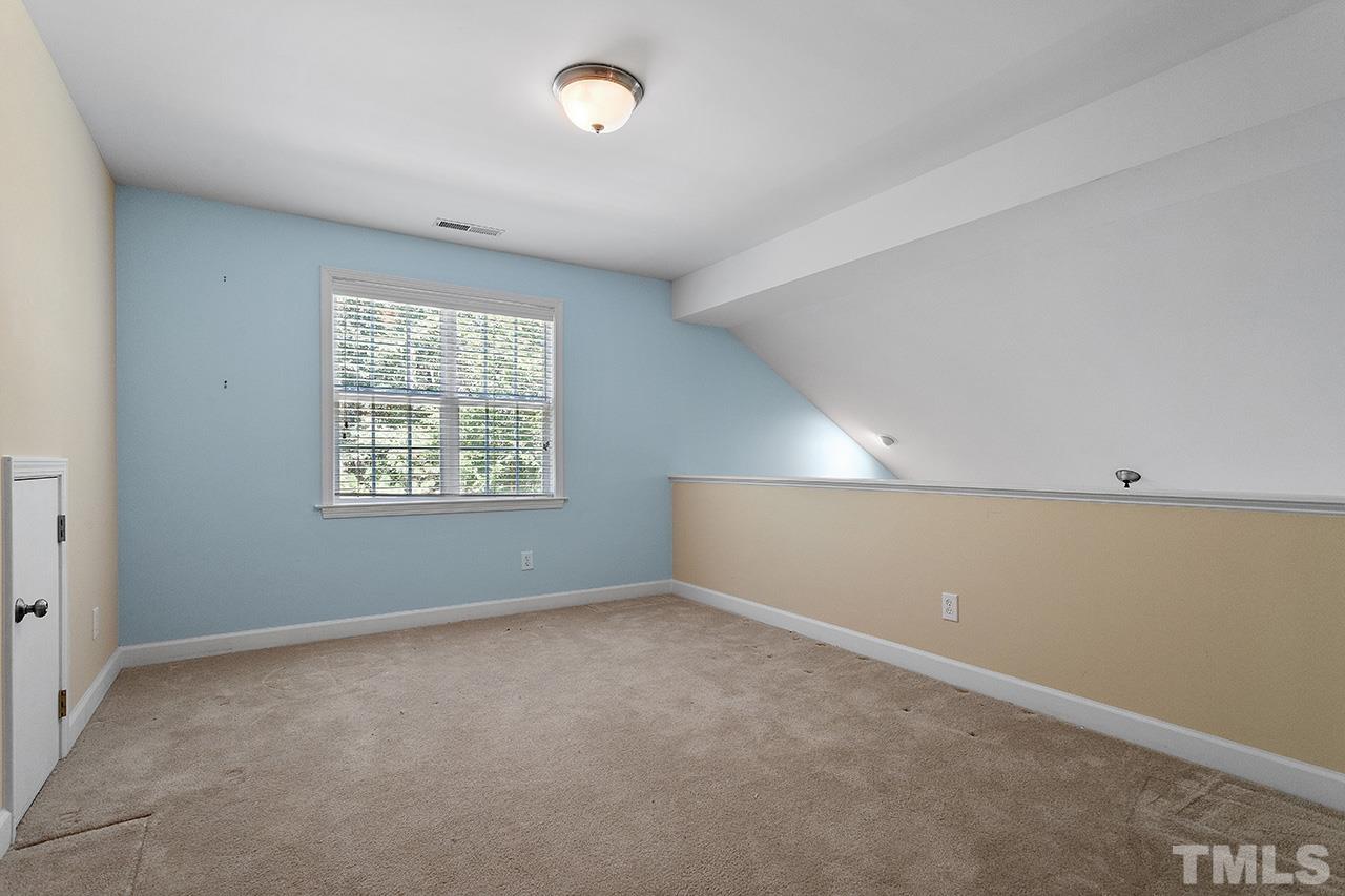 844 Horton Road, Unit 64 Durham, NC 27704 - Photo 20 of 25 an empty room with windows