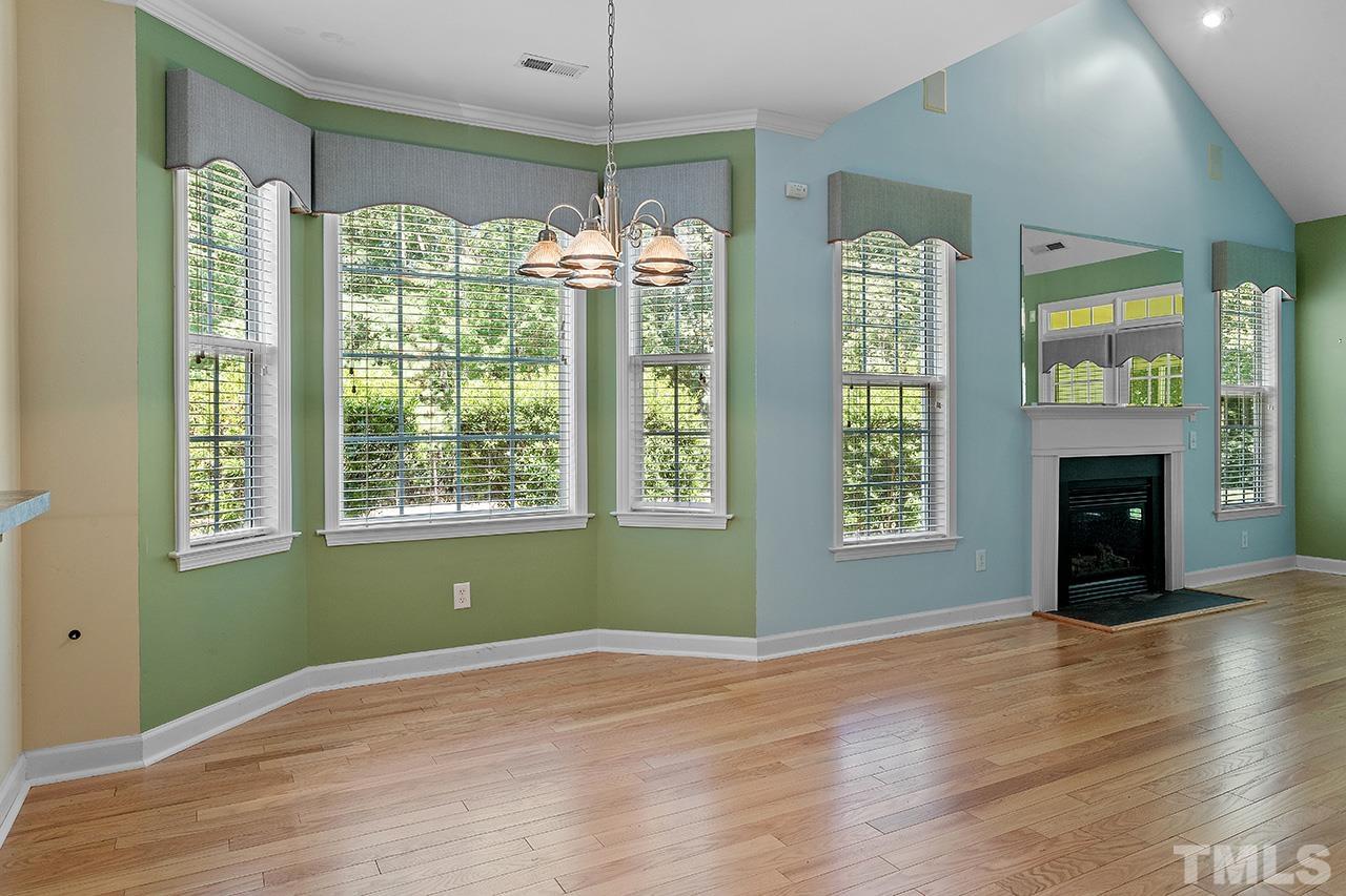 844 Horton Road, Unit 64 Durham, NC 27704 - Photo 8 of 25 a view of an empty room with window and wooden floor