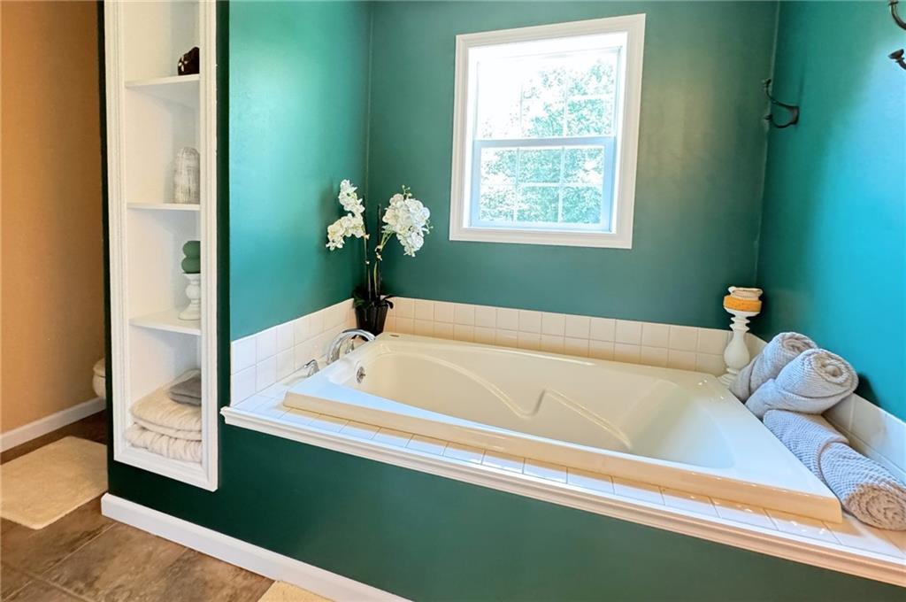 537 George Jr Road Grove City, PA 16127 - Photo 18 of 29 a bathroom with a tub and potted plant