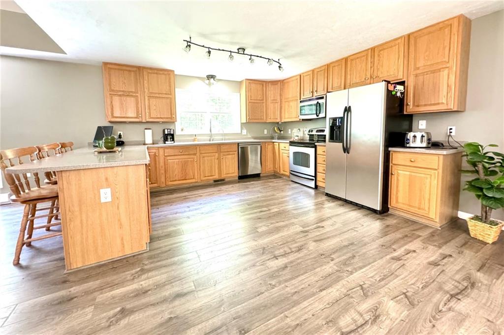 537 George Jr Road Grove City, PA 16127 - Photo 8 of 29 a kitchen with stainless steel appliances a refrigerator and a stove top oven