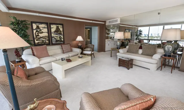 a living room with furniture or couch and a large window