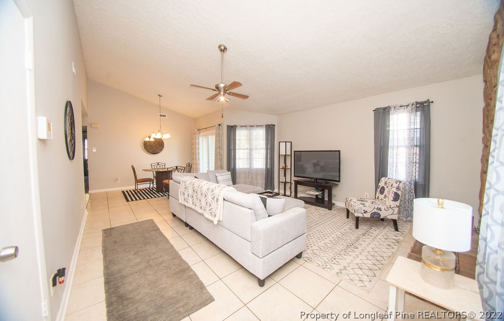 102 Duncan Road Spring Lake, NC 28390 - Photo 3 of 25 a living room with furniture and a flat screen tv
