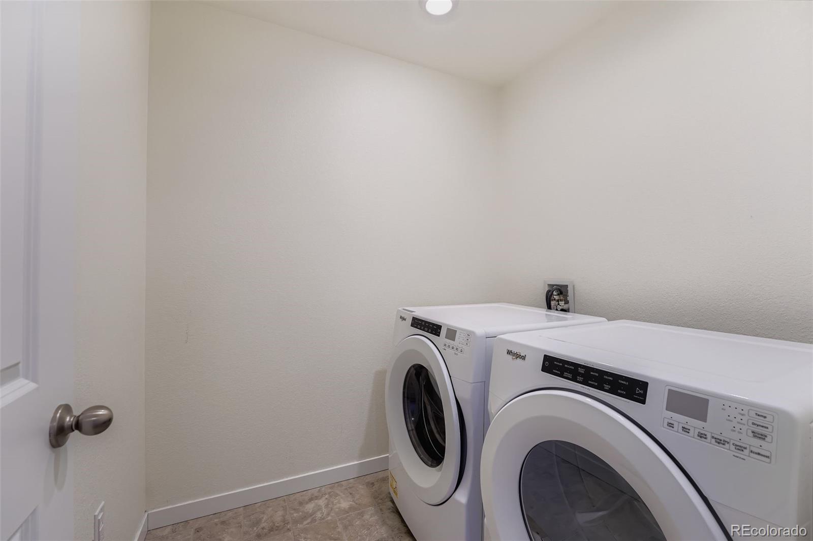 195 Yellowtail Street Bennett, CO 80102 - Photo 25 of 31 a utility room with dryer and washer
