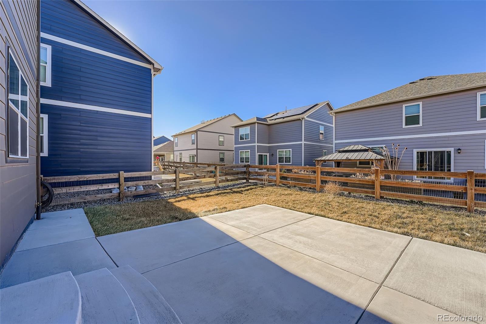 195 Yellowtail Street Bennett, CO 80102 - Photo 27 of 31 a view of a house with wooden fence