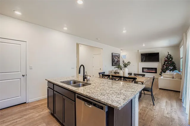 a kitchen with center island and stainless steel appliances